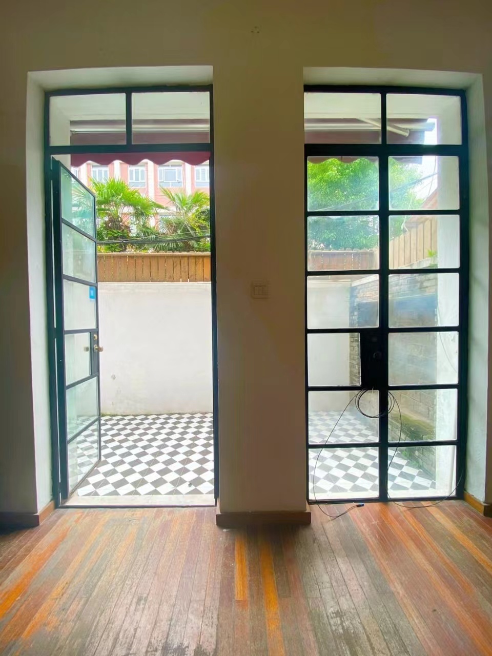 Old lane house with small yard and roof terrace on the quiet Xingguo Road for sale.